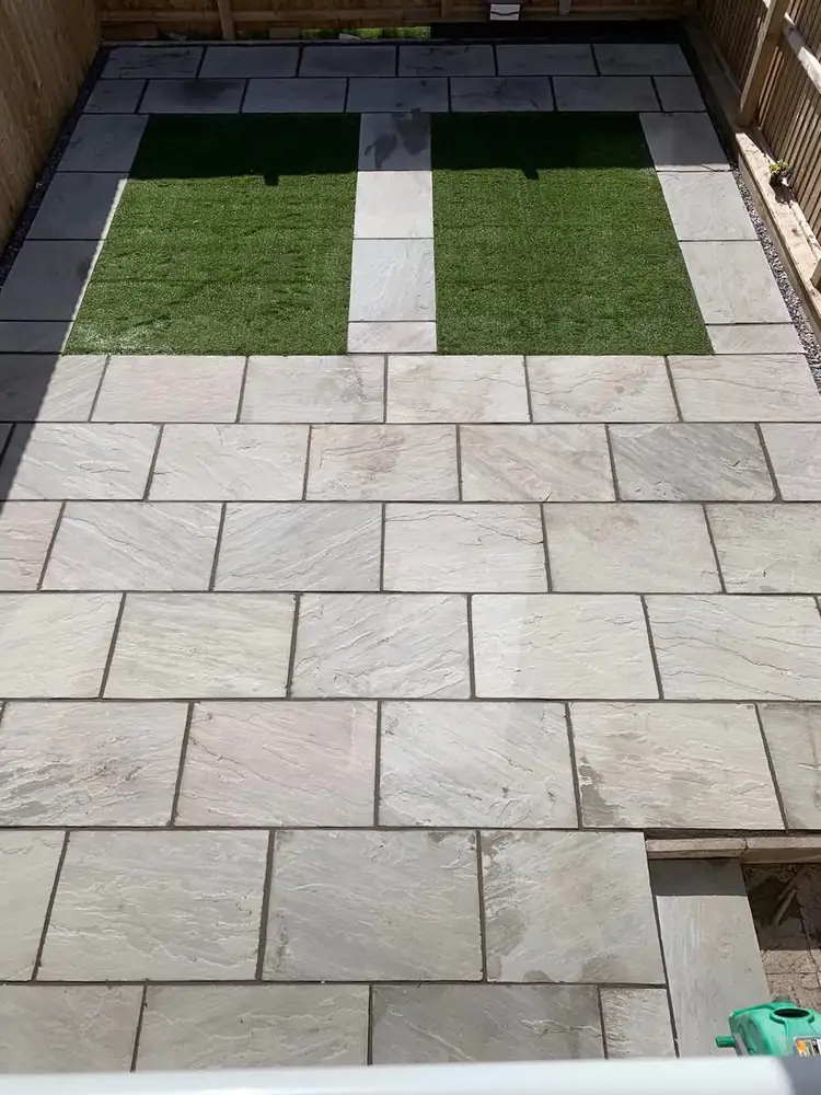 Sandstone paving and artificial grass