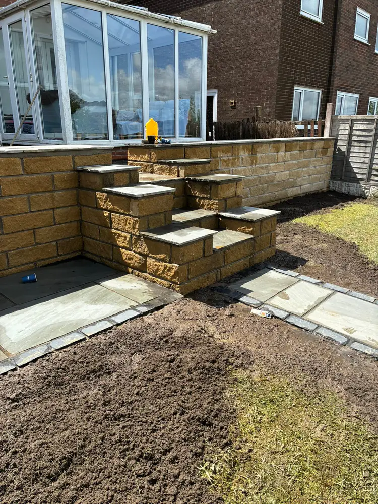 Sandstone garden steps and patio retaining wall
